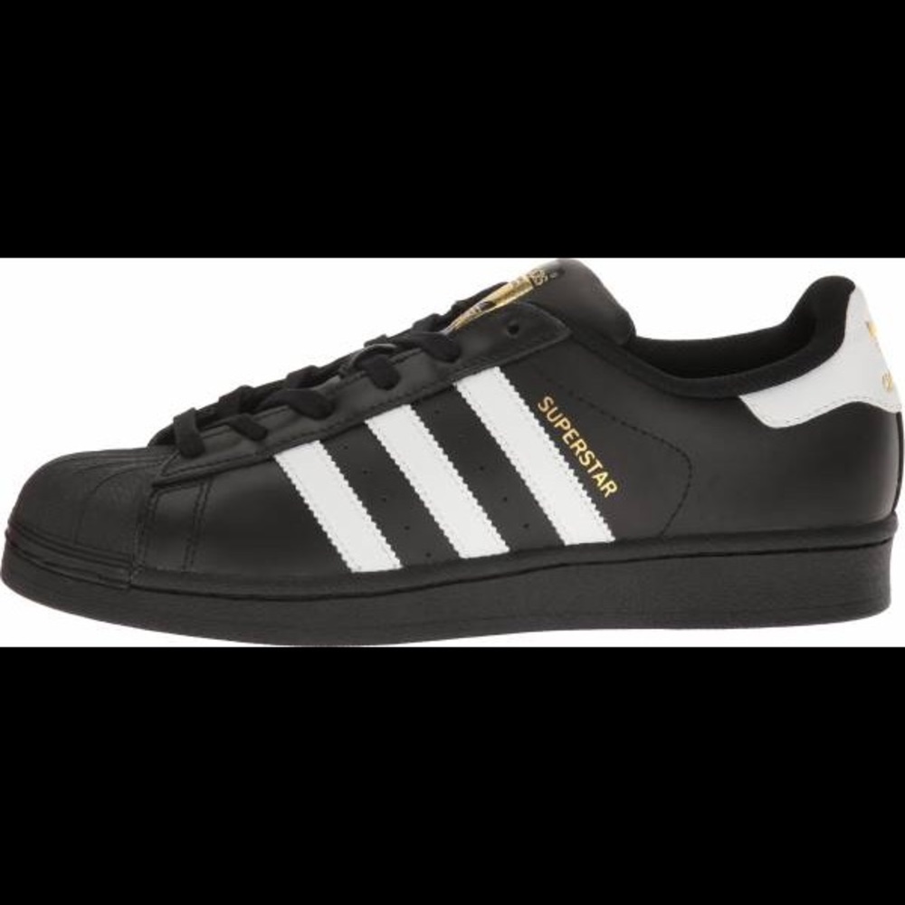 Black and white adidas superstars